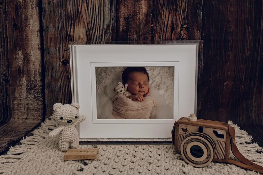 Newborn print products Cain Photography